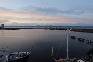 Calm water in port at sunset
