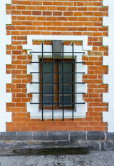 window of an old building with bars