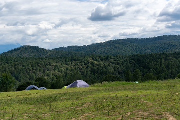 Fototapeta na wymiar tent on top of the mountain