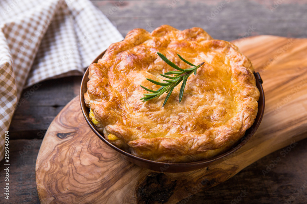 Wall mural individual chicken pot pie with puff pastry crust. top view