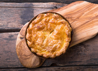Individual chicken pot pie with puff pastry crust. top view - obrazy, fototapety, plakaty