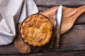 Individual chicken pot pie with puff pastry crust. top view