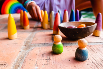 Toys for the unstructured game, made of colored wood to encourage free play.