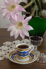 a cup of coffee on the wooden background.