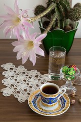 a cup of coffee on the wooden background.
