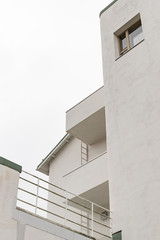 View from below on a white modern house. White tones, minimalist concept.