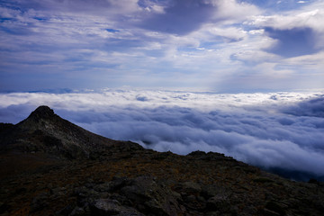 Fototapeta na wymiar Peñalara mountain peak in Madrid, a cold day of clouds.