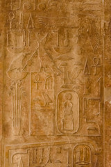 Egyptian ancient hieroglyphs on the stone wall