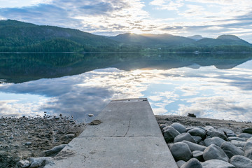 Fjord in the mountains with jetty 