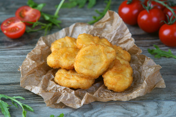 chicken nuggets on a wooden background
