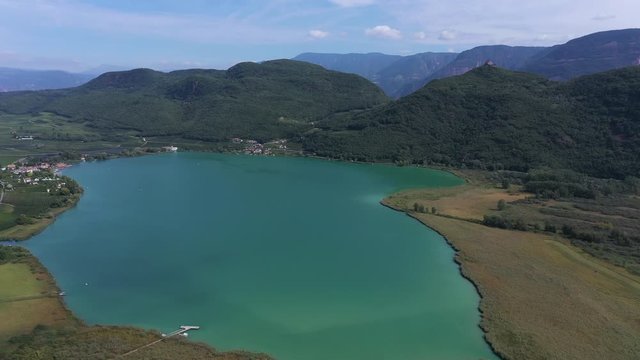 Aerial view. Wonderful panorama of Lake Kaltern, municipality of Kaltern in South Tyrol, Italy. Flying on drone.