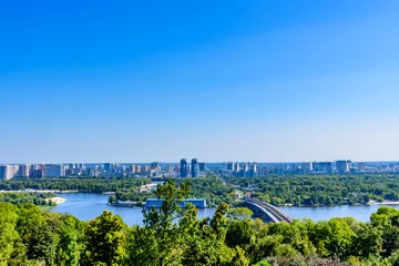 Zelfklevend Fotobehang View on residential districts on left bank of the river Dnieper in Kiev, Ukraine © ihorbondarenko