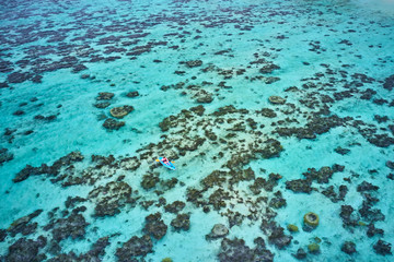 Kayaking on pristine blue water in Fiji from a 5 star resort drone aerial