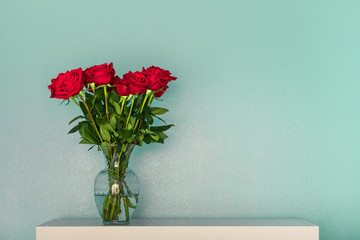Isolated red roses in a flower vase 