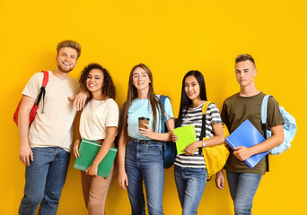 Group of students on color background