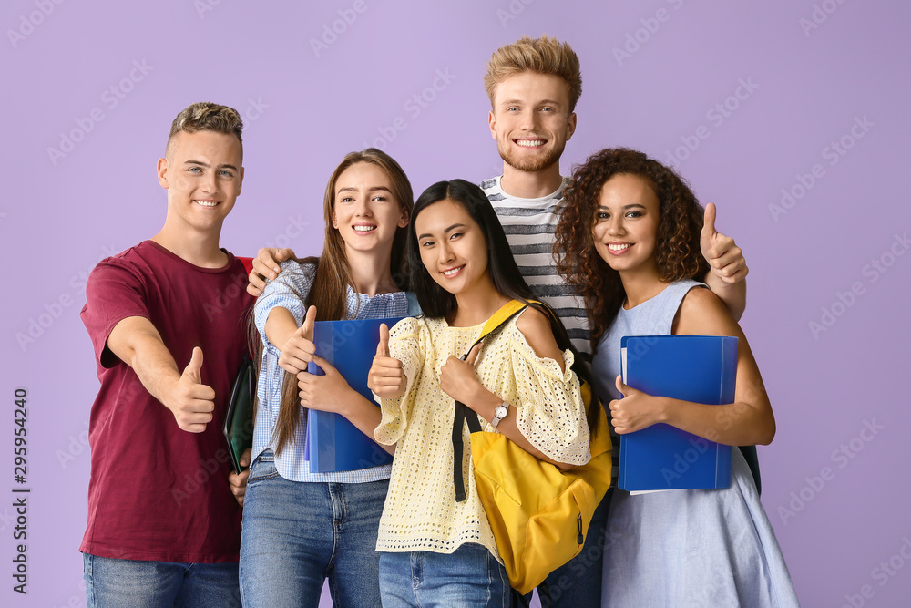 Poster group of students showing thumb-up gesture on color background