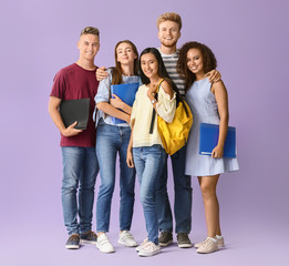 Group of students on color background
