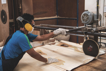 Workers working in wood factory furniture manufacturing.