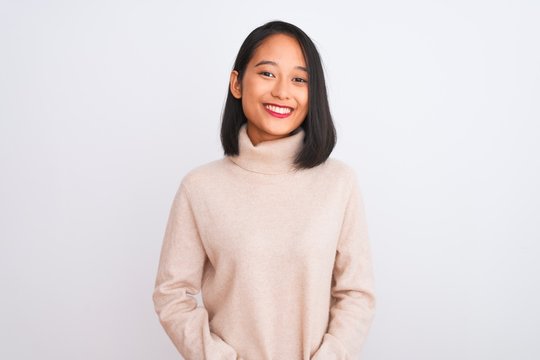 Young Chinese Woman Wearing Turtleneck Sweater Standing Over Isolated White Background With Hands Together And Crossed Fingers Smiling Relaxed And Cheerful. Success And Optimistic