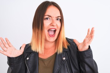 Young beautiful woman wearing t-shirt and jacket standing over isolated white background very happy and excited, winner expression celebrating victory screaming with big smile and raised hands