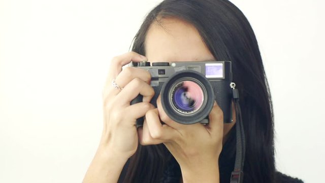 Woman Taking a Photograph into the camera