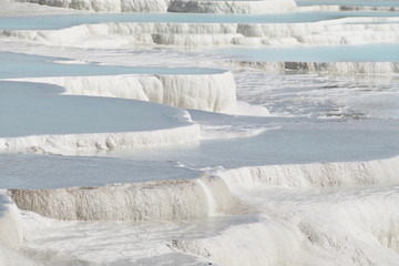 Pamukkale in Turkey is known for its mineral-rich thermal waters flowing down white travertine terraces. Pamukkale is nicknamed the cotton castle because of its white appearance.