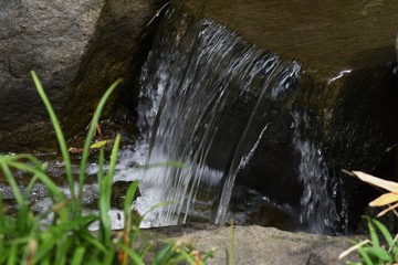 A small waterfall in a Japanese style garden