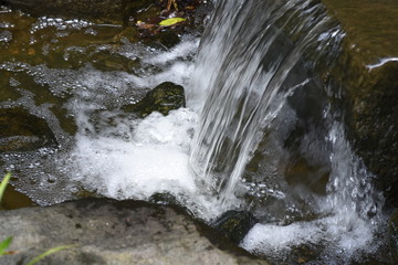 A small waterfall in a Japanese style garden