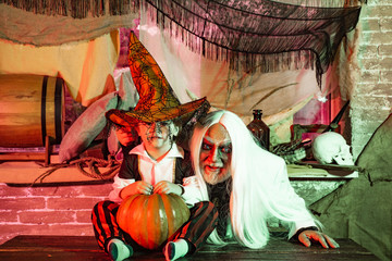 A terrible night on Halloween. Father and son has fun in Halloween time. Happy family celebrate...