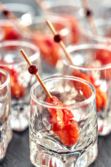 close-up canape with shrimp in glass soft background