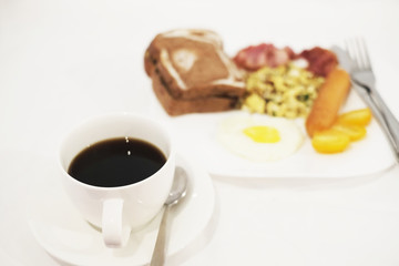  Hot coffee with a breakfast on white background
