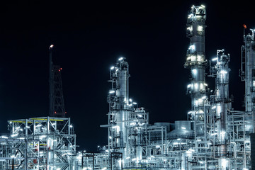 Close-up Industrial oil and gas refinery area at night.