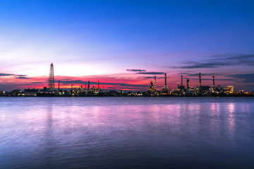 Fototapeta premium Panorama wide-angle Large oil and gas refinery industrial area and beautiful lighting at Twilight.