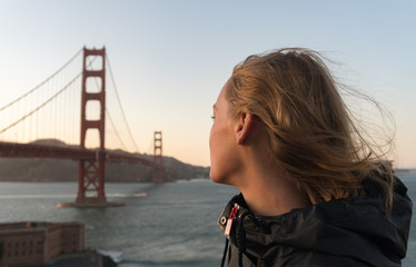 Beautiful Woman Enjoying The Golden Gate Bridge View at Sunset