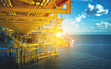 Offshore oil and gas rig platform with beautiful sky in the gulf of Thailand.