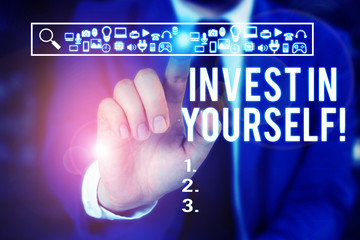 Word writing text Invest In Yourself. Business photo showcasing nvesting in a coach or a training to learn new things Male human wear formal work suit presenting presentation using smart device