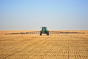 tractor working in field spraying 