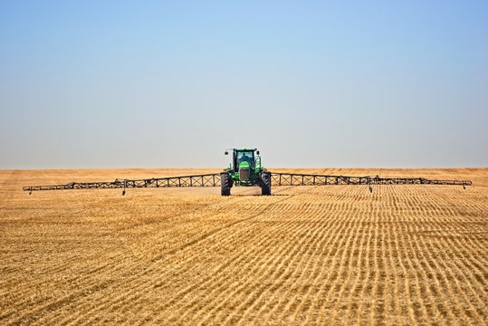 tractor working in field spraying 