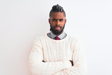 African american man with braids wearing white sweater over isolated white background skeptic and nervous, disapproving expression on face with crossed arms. Negative person.