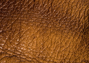 Old vintage genuine soft brown leather texture background, top layer with pores and scratches, macro, close-up