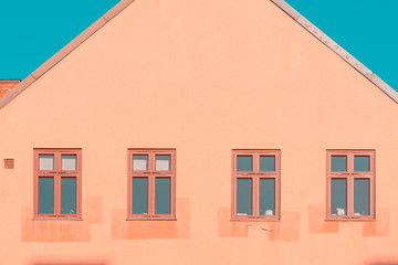 Old House with Windows against clear, blue sky. Minimal Aesthetics.