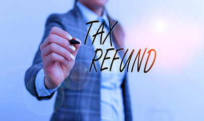 Conceptual hand writing showing Tax Refund. Concept meaning refund on tax when the tax liability is...