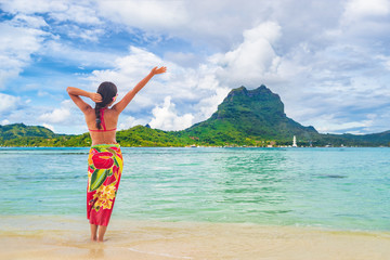 Vacation Travel woman walking on Tahiti paradise motu beach Bora Bora