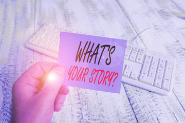 Text sign showing What S Your Story Question. Business photo showcasing asking demonstrating about his past life actions career or events man holding colorful reminder square shaped paper white