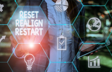 Handwriting text writing Reset Realign Restart. Conceptual photo Life audit will help you put things in perspectives Female human wear formal work suit presenting presentation use smart device