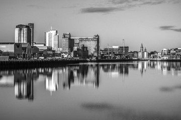 Cork Ireland city center harbor panorama view morning sunrise cold weather calm river water reflection buildings colors 
