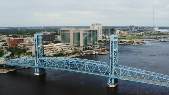 Aerial view of Jacksonville City, drone shooting of city, cloudy weather in Florida, bridges over the channel