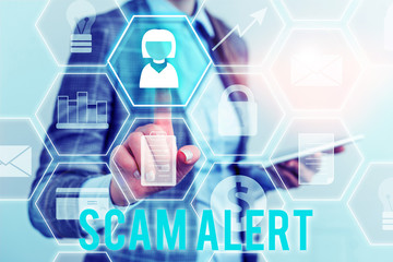 Writing note showing Scam Alert. Business concept for unsolicited email that claims the prospect of...