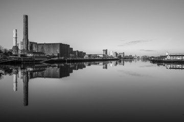 Fototapeta premium Cork Ireland city center harbor panorama view morning sunrise cold weather calm river water reflection buildings colors 