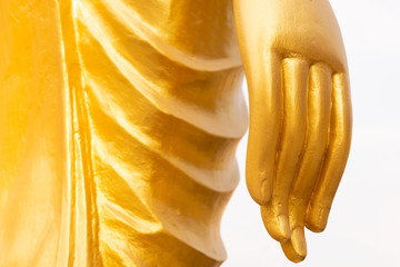 Closeup hand of golden buddha statue.